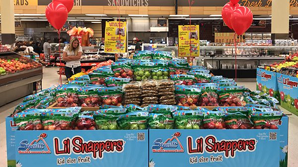 Jewel Walnut Lil Snappers produce display at grocery store.